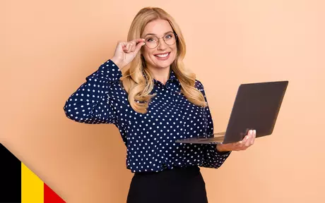 Smiling woman with glasses and laptop