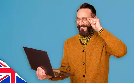 Man with cardigan and laptop