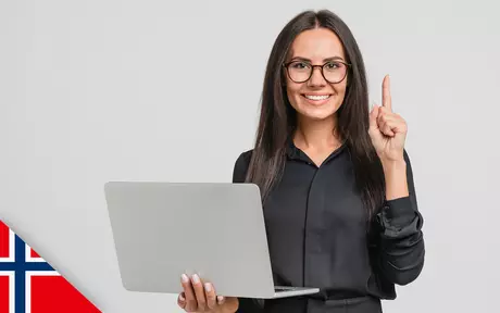 Woman with glasses holding laptop