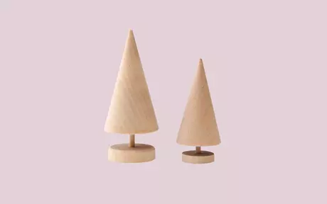 Two wooden trees on a pink background