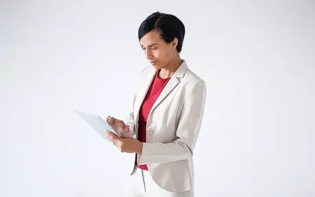 Smart dressed woman looking at her tablet