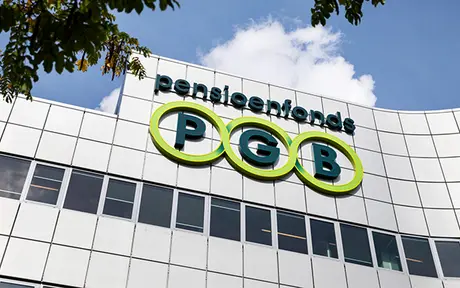 Exterior view of the PGB Pensioendiensten office building with the PGB logo prominently displayed on a modern glass and metal façade.