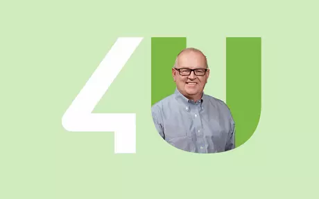 man with glasses inside the unit4 logo with green background