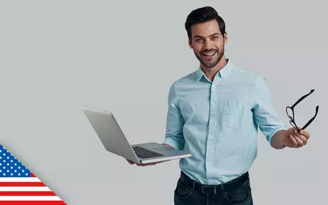 Image of man holding laptop